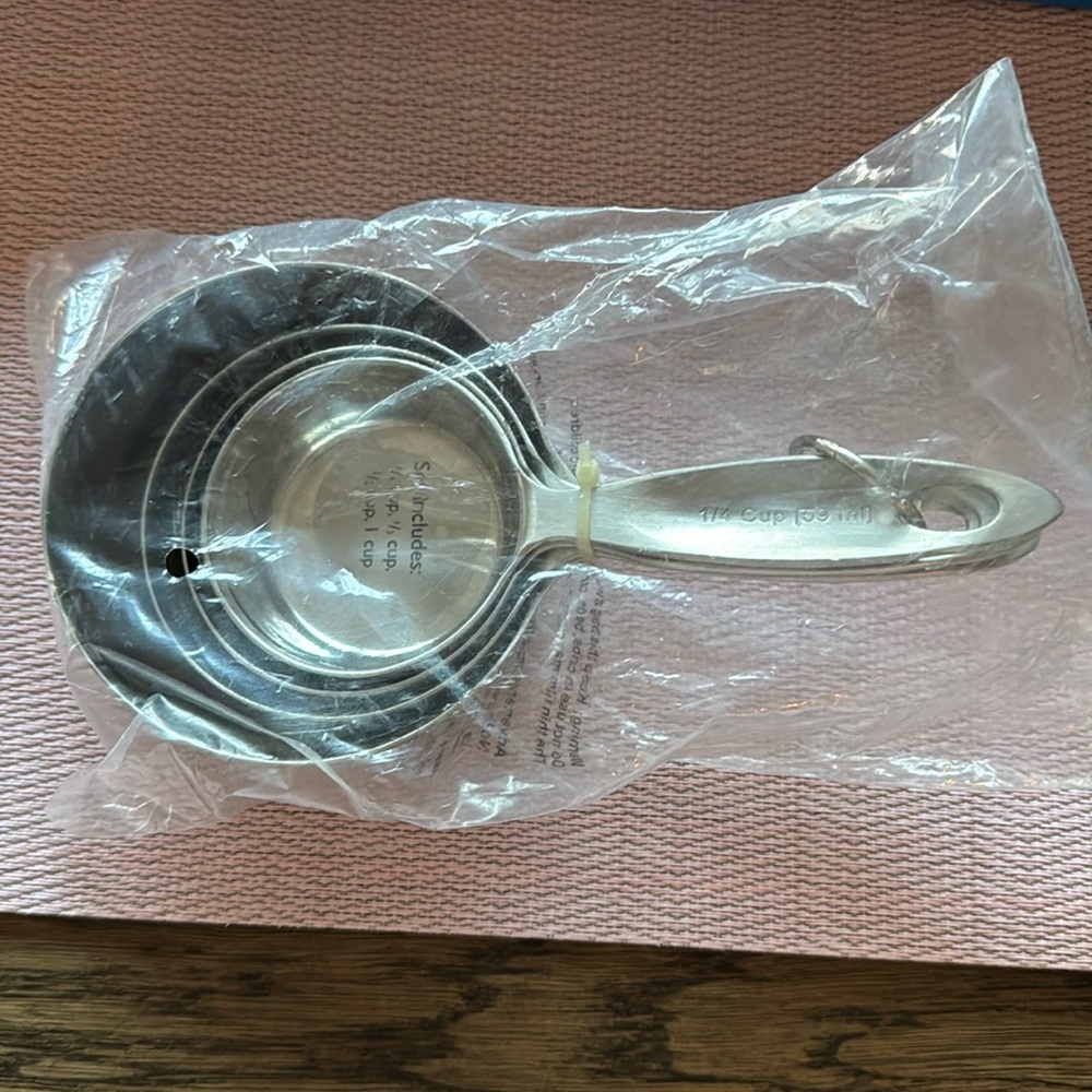 New in packaging Crate & Barrel rust-proof stainless steel measuring cup set